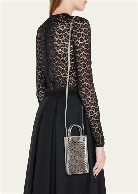 alaia perforated crossbody bag.